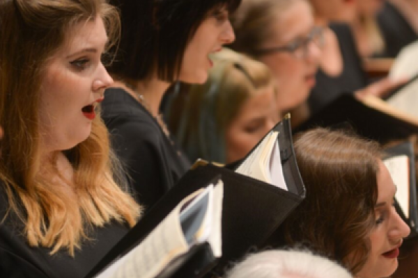 A close up of singers in the Kent Chorus