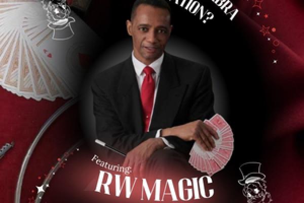 A magician holding a fanned out deck of cards and a magic want.