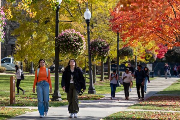 Kent State University students walk across campus on a fall day. (Photo credit: Bob Christy)