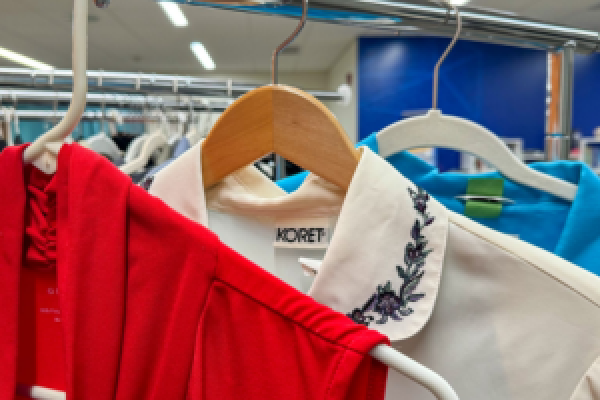 Professional clothing hanging on a clothing rack.