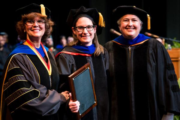 Pictured with Dean Denise Seachrist (left) and Faculty Chair Deirdre Warren (right), Dr. Lindsay Starkey is the recipient of the 2017 Distinguished Teaching Award.