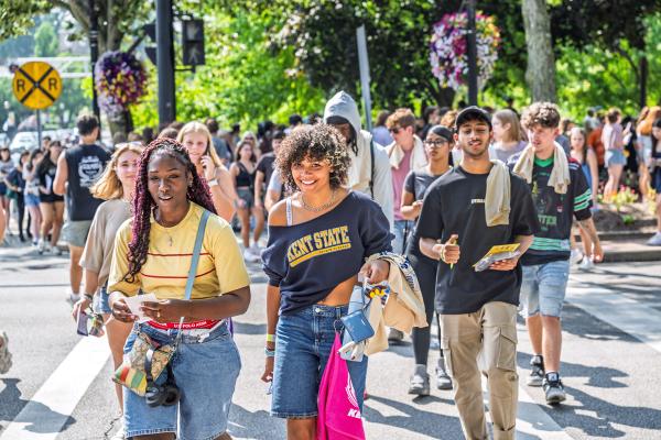 A large group of Kent State students explore downtown Kent, Ohio, during Flashes First Friday.