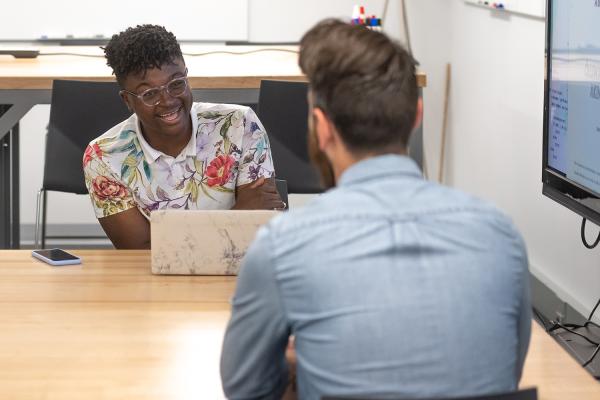 Student working with staff member