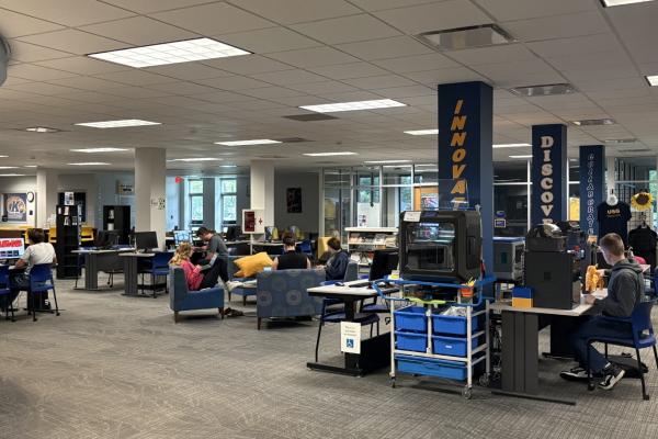 Tuscarawas campus library space, with students working at various computer stations