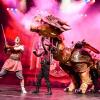 Dragons and Mythical Beast scene with actors and large dragon puppet