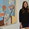 Katie Butler in her Akron studio, with “A Seat at the Table” to her left. | Canvas photo / Amanda Koehn