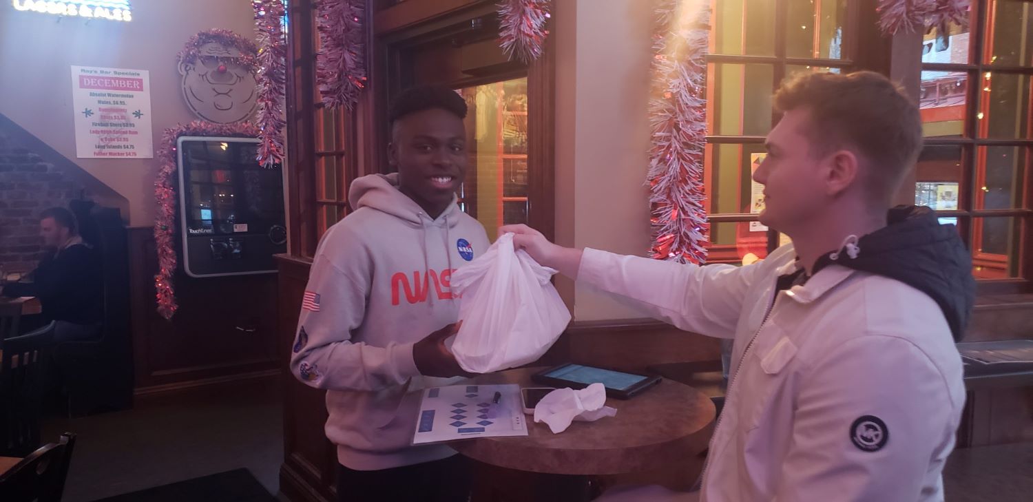 Josh Sullivan, a Kent State student from Brooklyn, Ohio, works as a doorman at Ray's Place.