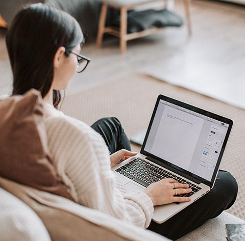 Woman typing on laptop